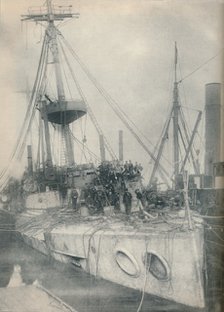 'A Salvage Triumph. The cruiser Gladiator, supported by salvage tugs', 1908, (1936). Artist: Unknown.