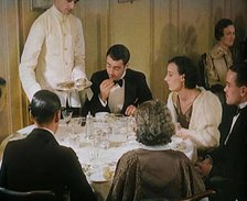 Upper Class People Enjoying a Meal in a Restaurant, 1931. Creator: British Pathe Ltd.