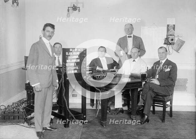 Bobroff Voting Machine - Being Considered For Use In House, Standing Right To Left: Reps..., 1917. Creator: Harris & Ewing.