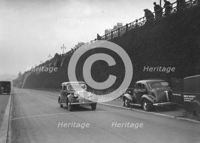 Rover saloon of A Corrie competing in the RAC Rally, Madeira Drive, Brighton, 1939. Artist: Bill Brunell.