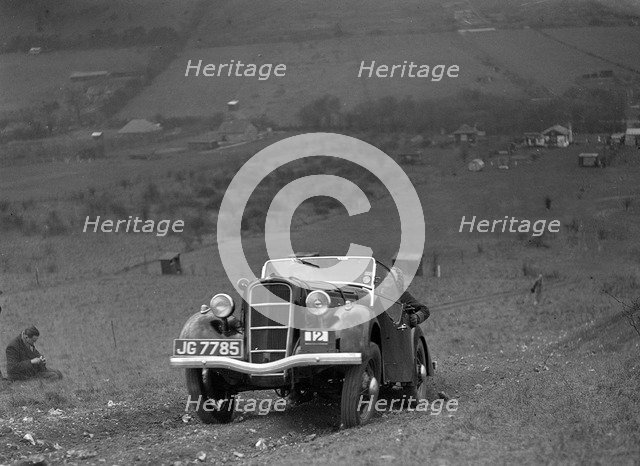 Ford Model C Ten competing in the London Motor Club Coventry Cup Trial, Knatts Hill, Kent, 1938. Artist: Bill Brunell.