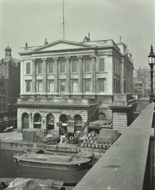 Barges and goods in front of Fishmongers Hall, seen from London Bridge, 1912. Artist: Unknown.