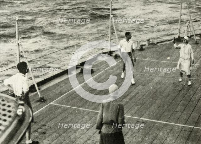 'Their Majesties, in a Game of Deck Quoits on Deck of H.M.S. "Renown", 1927', 1937. Creator: Unknown.