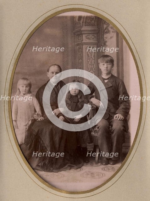 An elderly woman, a young man in a civilian suit and two.,, late 19th cent - early 20th cent. Creator: PA Milevskii.