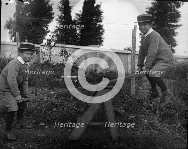 Frederick Robert L'Estrange on a see saw, c1895. Creator: Robert Augustus Henry L'Estrange.