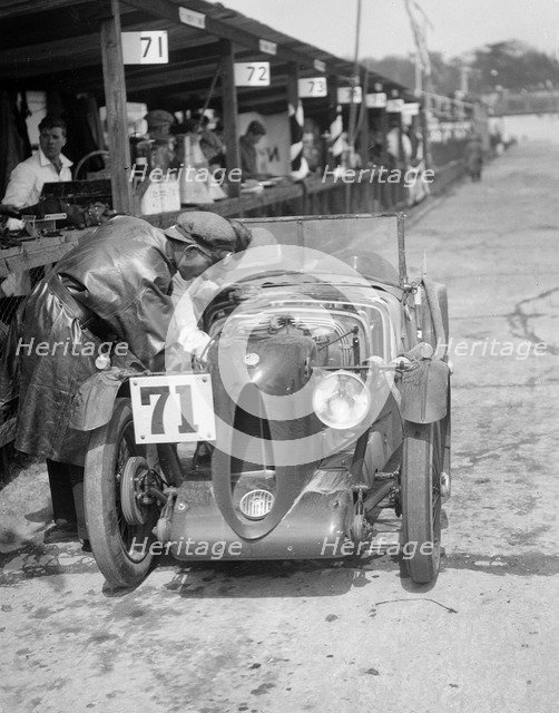 MG C type of Ron Horton and Bill Humphreys in the pits, JCC Double Twelve race, Brooklands, 1931. Artist: Bill Brunell.