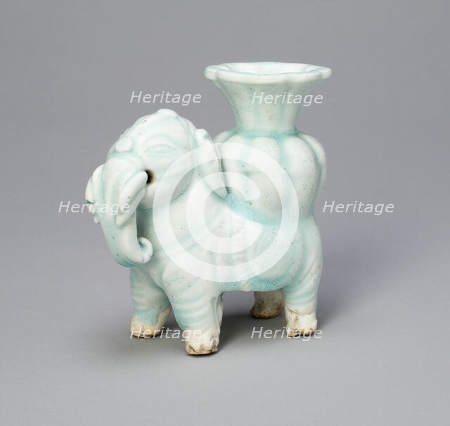 Joss-Stick Holder in the Form of an Elephant Holding a Lobed Vase, Yuan dynasty (1271-1368). Creator: Unknown.