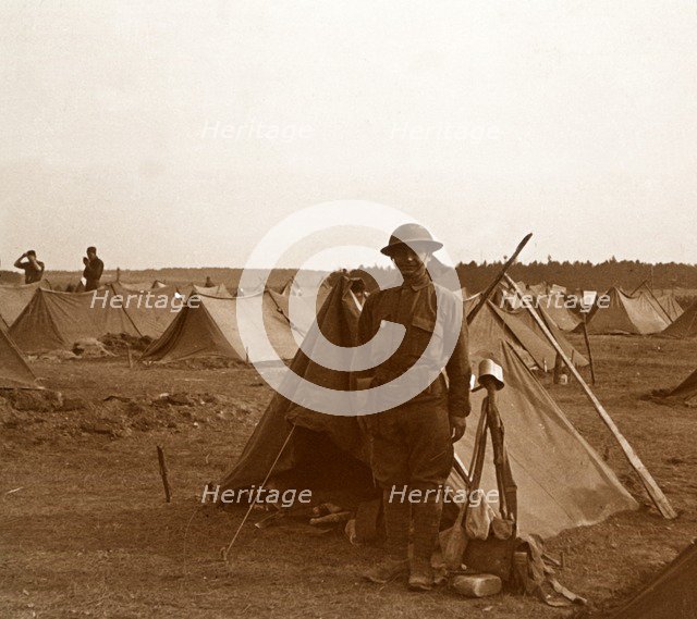 Soldier standing by tent, American camp, Melette, France, c1914-c1918.  Artist: Unknown.
