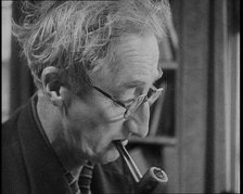 A.P. Herbert Smoking a Pipe, 1930s. Creator: British Pathe Ltd.