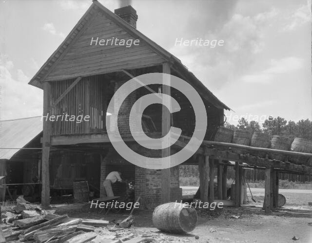 Turpentine still in the Piney Woods near Valdosta, Georgia, 1937. Creator: Dorothea Lange.