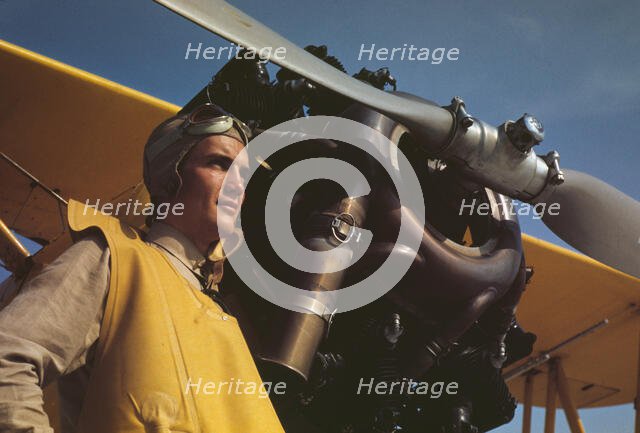 Marine lieutenant by the power plane which tows...at Page Field, Parris, Island, S.C., 1942. Creator: Alfred T Palmer.