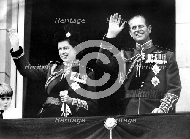 Queen Elizabeth II and Prince Philip waving from the balcony of Buckingham Palace, London, 1970. Artist: Unknown