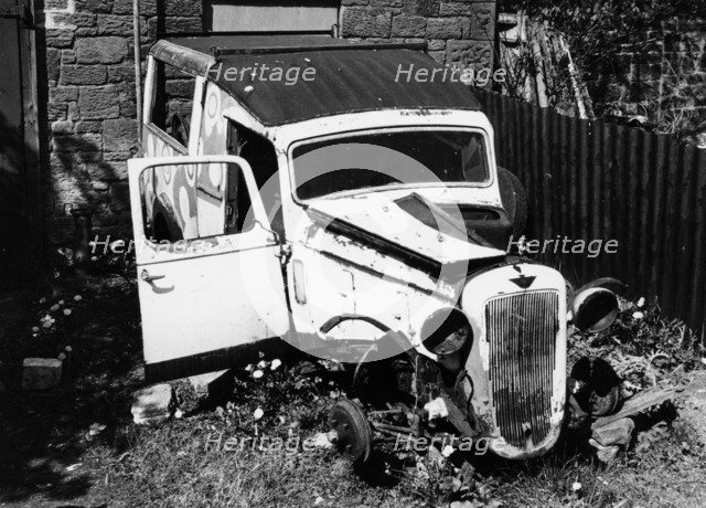 Wreck of a 1939 Austin 10. Artist: Unknown