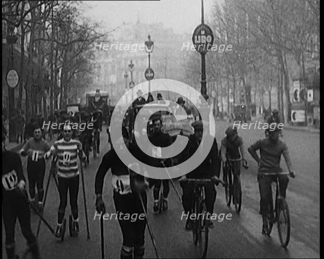 Racers Skiing Through Paris, France on Wheeled Skis, 1929. Creator: British Pathe Ltd.
