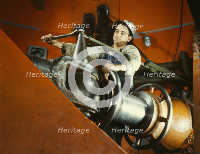 Tightening a nut on a guide vane operating seromotor in TVA's..., Watts Bar Dam, Tennessee, 1942. Creator: Alfred T Palmer.