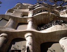 La Pedrera or Mila House, completed in 1912, detail of the stone blocks of the façade seen from b…