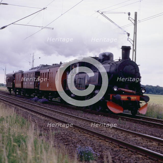 Steam locomotive 1277 and passenger cars, museum railway, Sweden, 1960s.
 Creator: Unknown.