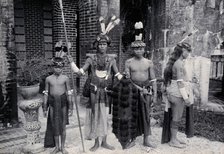 Sarawak: Sea Dayaks with weapons and head-dresses, c1900. Creator: Unknown.