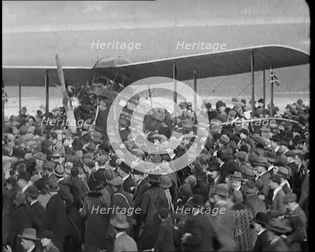 A Large Group of People Crowding Around Sir Alan Cobham's Aeroplane Greeting Him on His..., 1926. Creator: British Pathe Ltd.