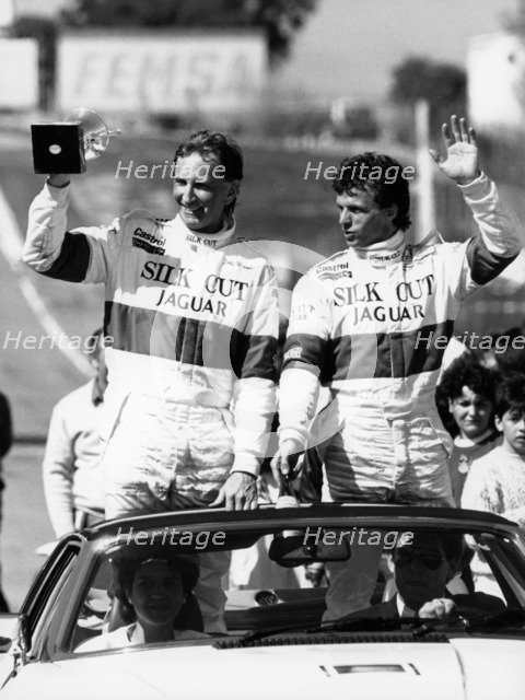 John Watson and Jan Lammers waving at the crowds at Jarama, Spain, 1987. Artist: Unknown