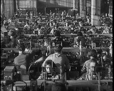 Female Civilians Working on a Factory Production Line, 1931. Creator: British Pathe Ltd.