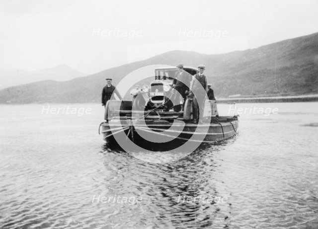 An early ferry transporting a car across a lake. Artist: Unknown