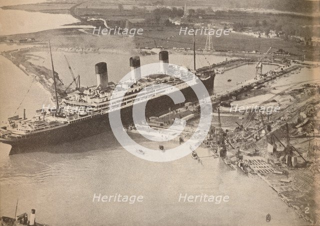 'The White Star Liner Majestic entering the world's largest graving dock at Southampton', c1934, (19 Artist: Unknown.