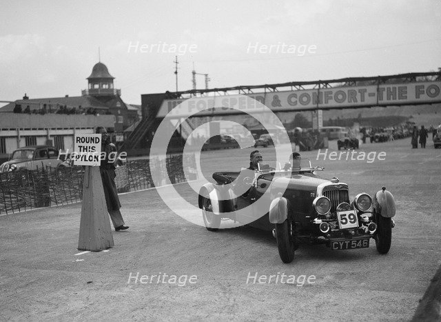 Aston Martin 4-seat open tourer competing in the JCC Rally, Brooklands, Surrey, 1939. Artist: Bill Brunell.
