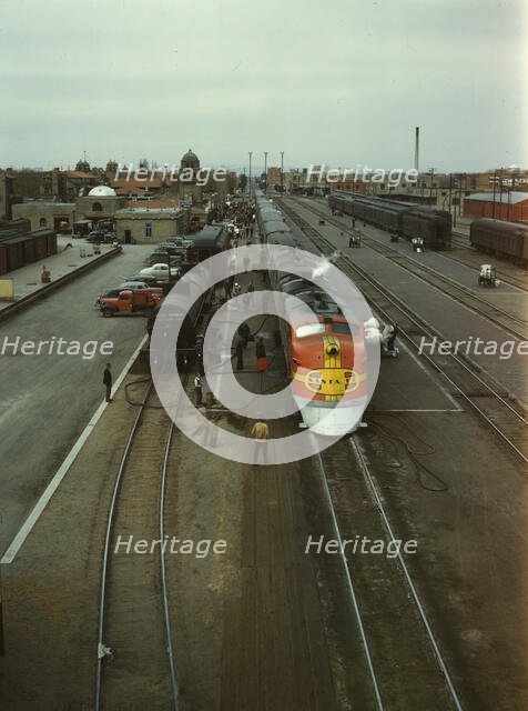 Santa Fe R.R. streamliner, the "Super Chief," being serviced..., Albuquerque, N.Mexico, 1943. Creator: Jack Delano.