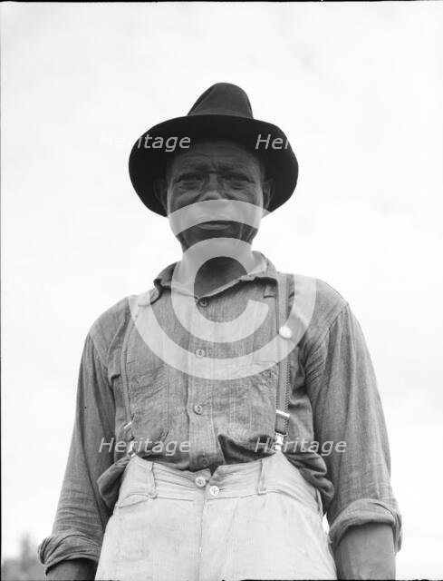 At Hill House, Mississippi - He wears the union button, 1936. Creator: Dorothea Lange.