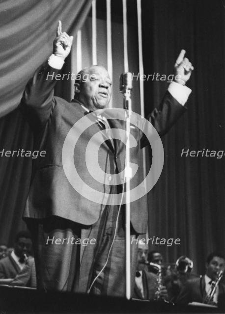 Jimmy Rushing and the Basie Band; with Frank Wess, London, 1963. Creator: Brian Foskett.