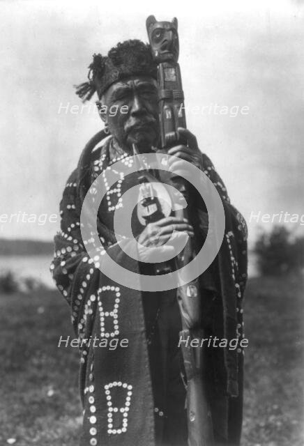 Hamasaka in Tluwulahu costume with speaker's staff-Qagyuhl [principal chief], c1914. Creator: Edward Sheriff Curtis.