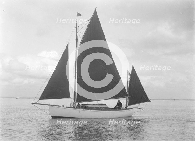The 4 ton yawl 'Mandy' under sail, 1922. Creator: Kirk & Sons of Cowes.