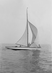 The 6 Metre 'Vanda' sailing with spinnaker, 1914. Creator: Kirk & Sons of Cowes.