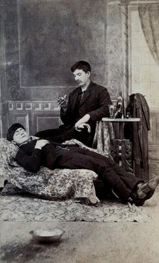 A man taking the pulse of another man, between 1800 and 1899. Creator: Unknown.