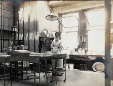 St Bartholomew's Hospital, London: nurse in operating theatre, c1890. Creator: Unknown.