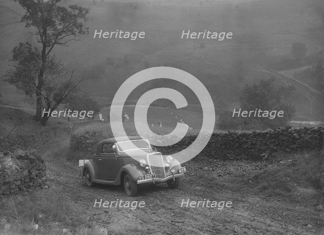 Ford V8 2-seater and dickey of IDK Stewart competing in the MCC Sporting Trial, 1935. Artist: Bill Brunell.