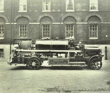 Firemen aboard a foam tender, London Fire Brigade Headquarters, London, 1929. Artist: Unknown.