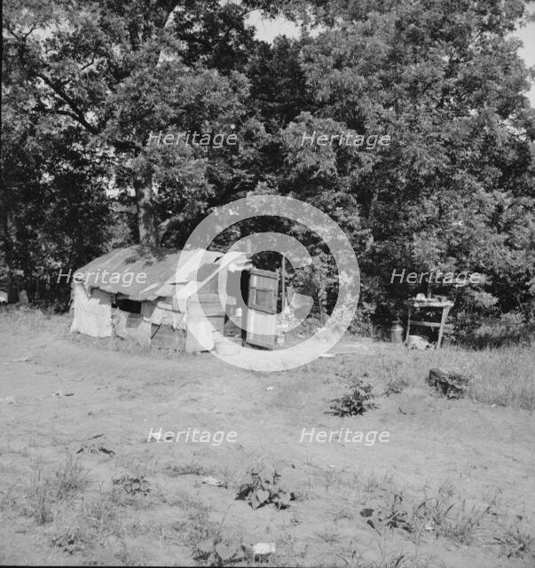 Family camped on U.S. Highway 63, Cache County, Oklahoma, 1937. Creator: Dorothea Lange.