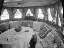 Cruising in comfort, the saloon of motor yacht 'Scaramouche', 1927. Creator: Kirk & Sons of Cowes.