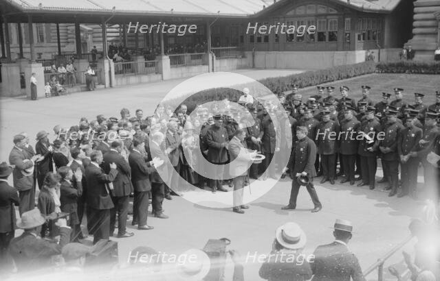Presenting pen to Wallis, between c1915 and c1920. Creator: Bain News Service.