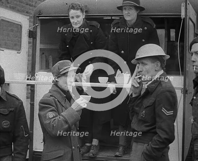 Civil Defence Corps Members Drinking Tea, 1940. Creator: British Pathe Ltd.