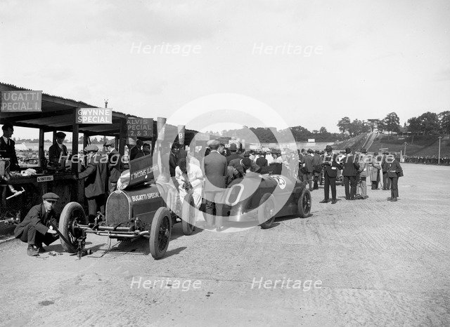 Bugatti Special 1 and Gwynne Special in the pits at a BARC meeting, Brooklands, 1933. Artist: Bill Brunell.