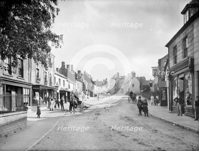 Looking up Church Street with people in the street and outside shop premises, Charlbury, Oxon, 1888. Creator: Henry Taunt.