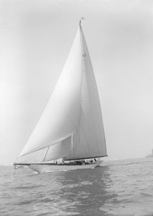 The 23-metre cutter 'Astra' sailing close-hauled, 1928. Creator: Kirk & Sons of Cowes.