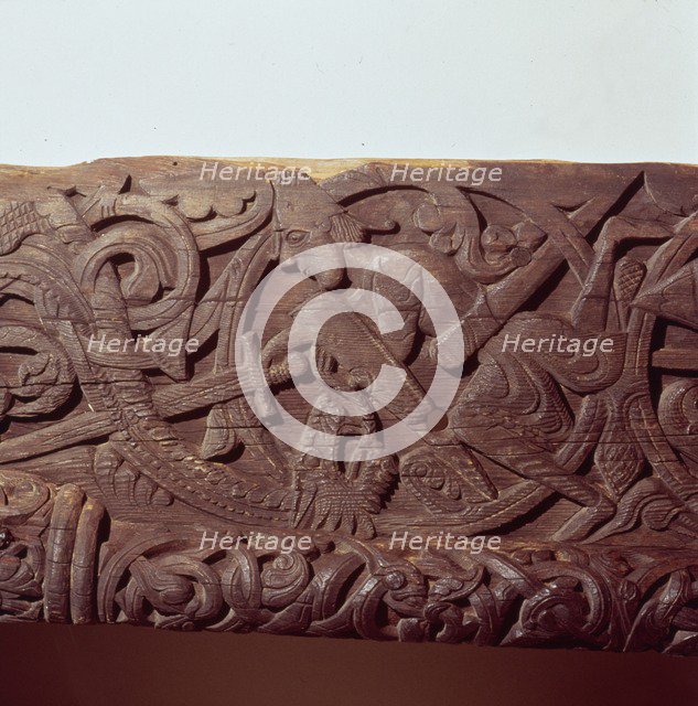 Sigurd kills the Dragon, Fafnir. Detail of wood panel of Hylestad Church, Norway.  Artist: Unknown.