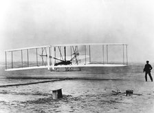 Wilbur and Orville Wright and the first powered flight, North Carolina, December 17 1903. Artist: Unknown