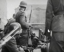 German Soldiers in a Bomb-Damaged Town, 1941. Creator: British Pathe Ltd.