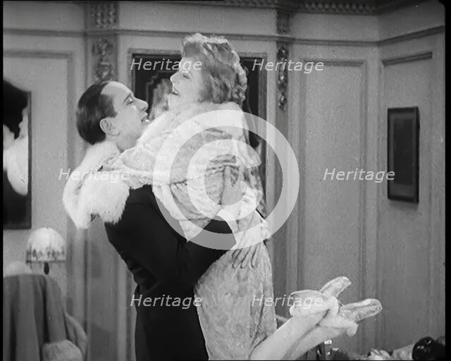 Scene from the Film 'Champagne': The Actress Betty Balfour Embracing the Male Actor Jean..., 1920s. Creator: British Pathe Ltd.