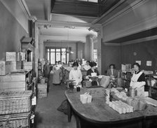 Women packing groceries at the National Food Fund building, London, February 1915. Artist: Adolph Augustus Boucher.